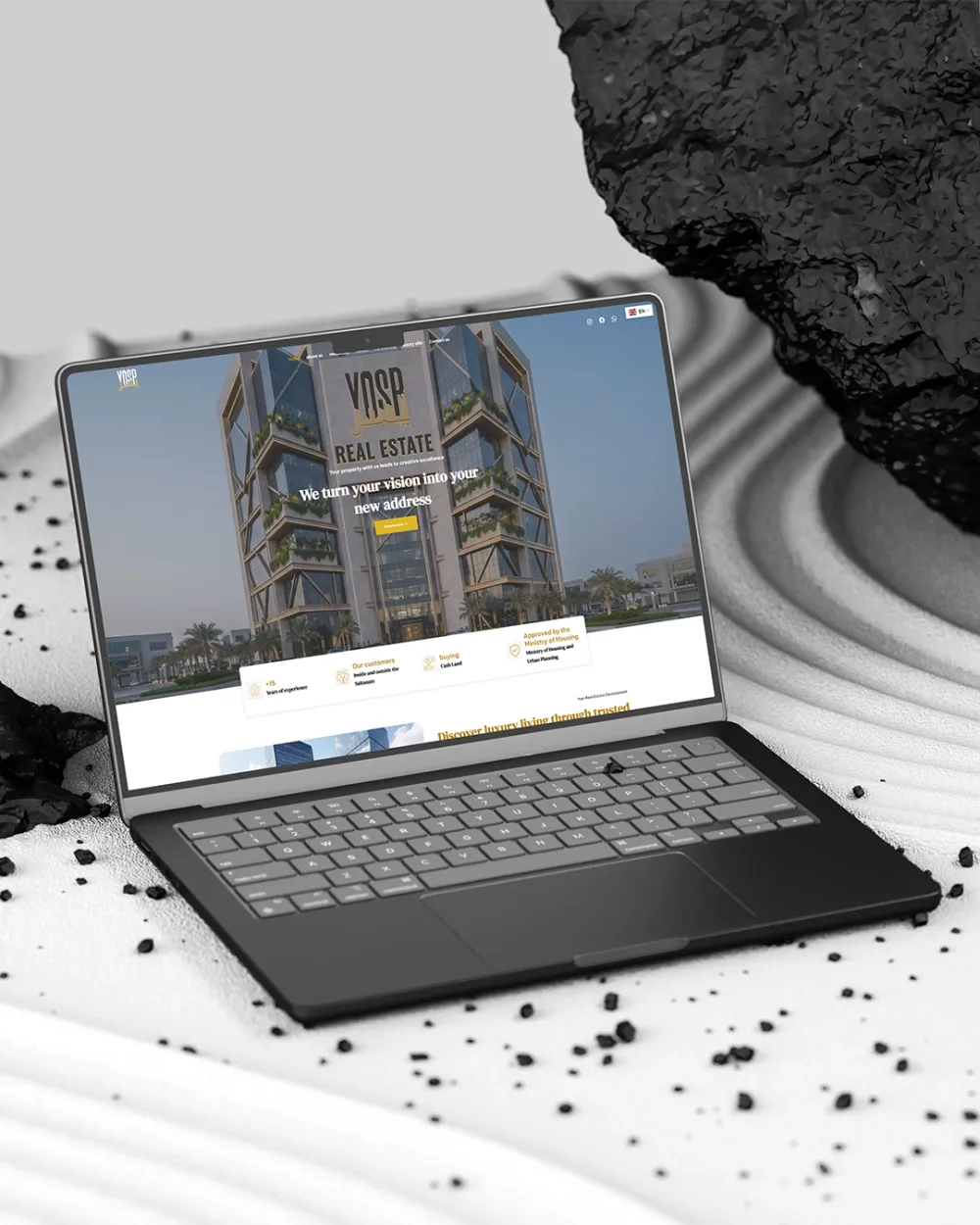 Yosr Real Estate homepage on a laptop