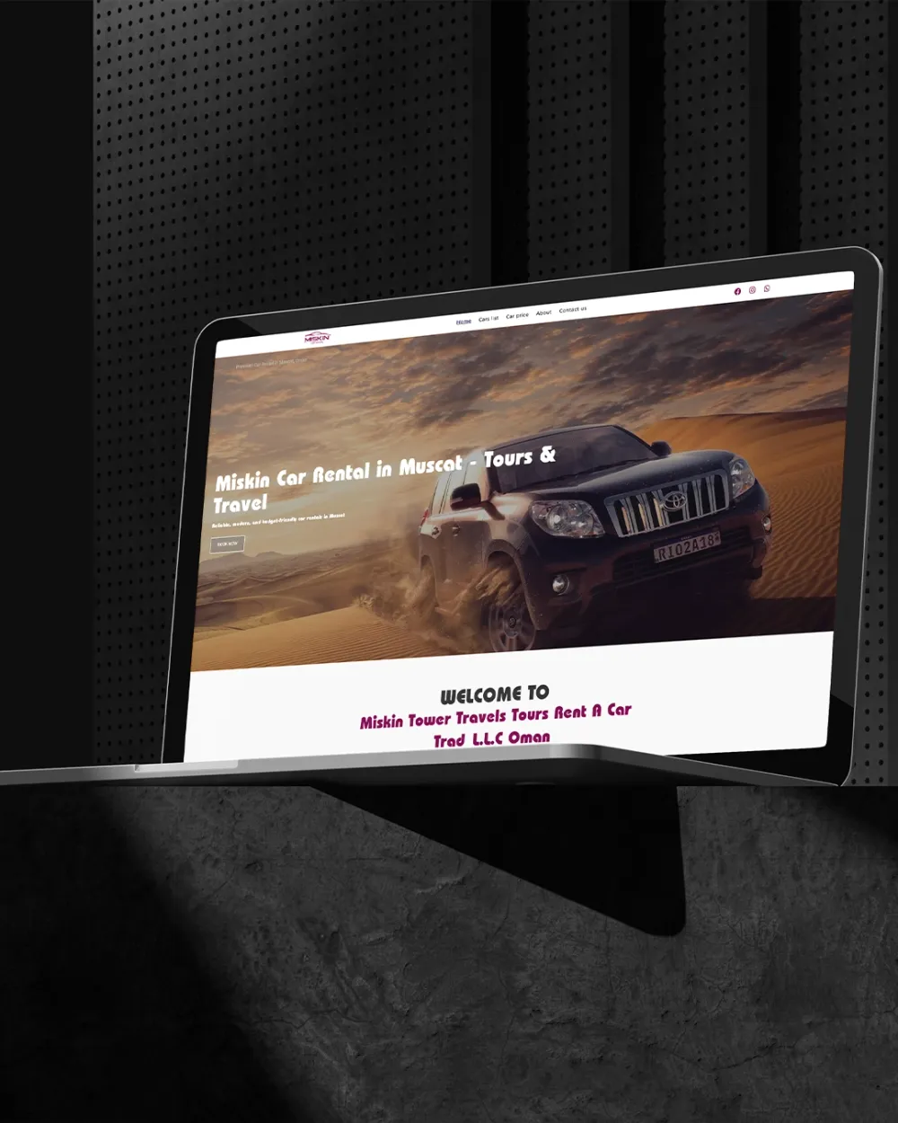 Miskin Car Rental homepage on a laptop