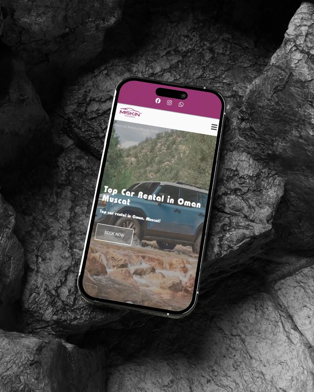 Miskin Car Rental homepage in a hand held phone